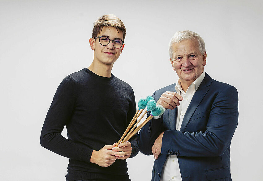 On the left is a young man holding timpani mallets. Next to him is Josef Ortner.