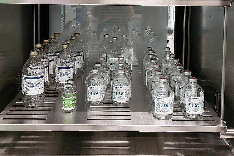 Inside the ozone lock are transparent bottles of different sizes.