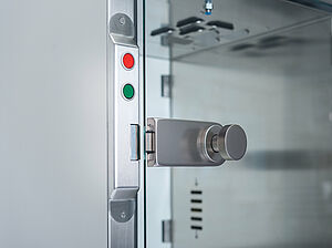 This is a closeup shot of the door handle and their buttons for opening and closing the door
